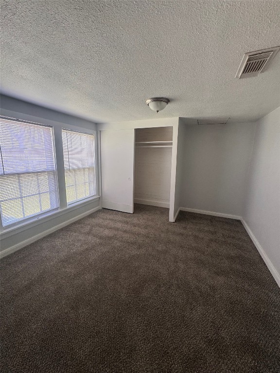 512 Rice Street Angleton, TX 77515 - Photo 9 of 12 an empty room with windows