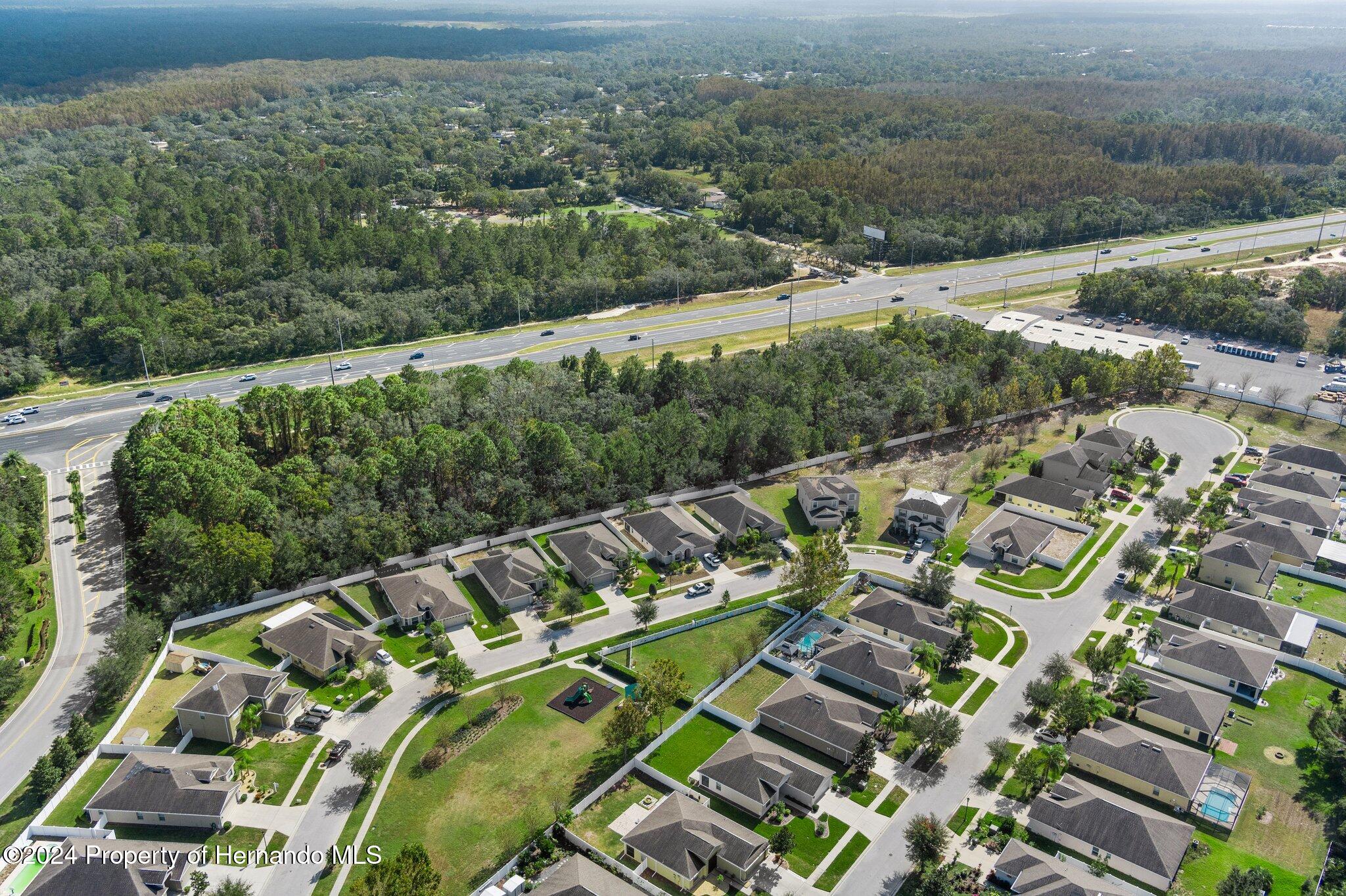 18119 Us-19 Hudson, FL 34667 - Photo 13 of 47 an aerial view of a house with a yard