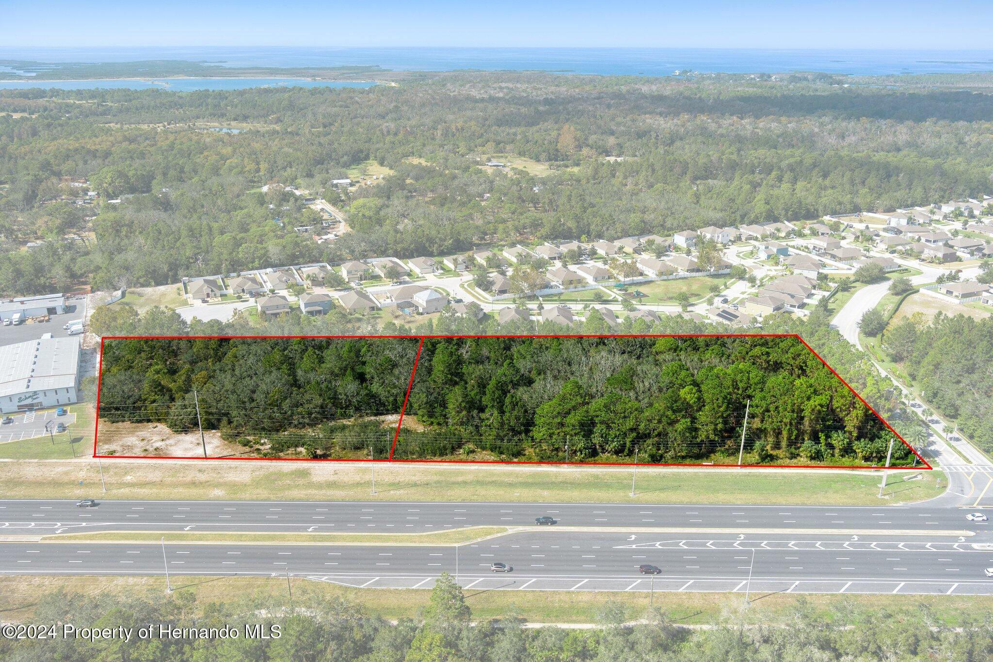 18119 Us-19 Hudson, FL 34667 - Photo 25 of 47 a view of a lake from a yard