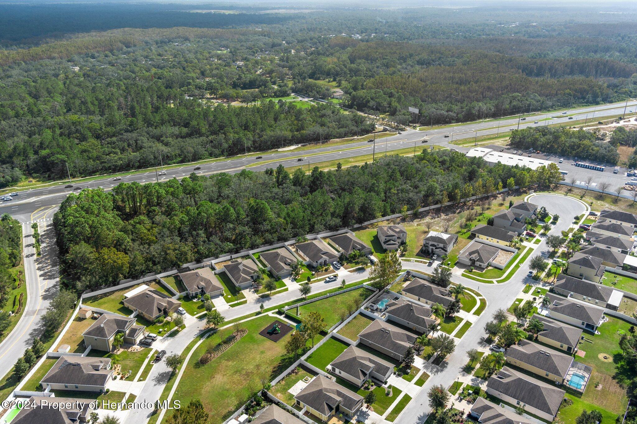 18119 Us-19 Hudson, FL 34667 - Photo 30 of 47 an aerial view of a house with a yard