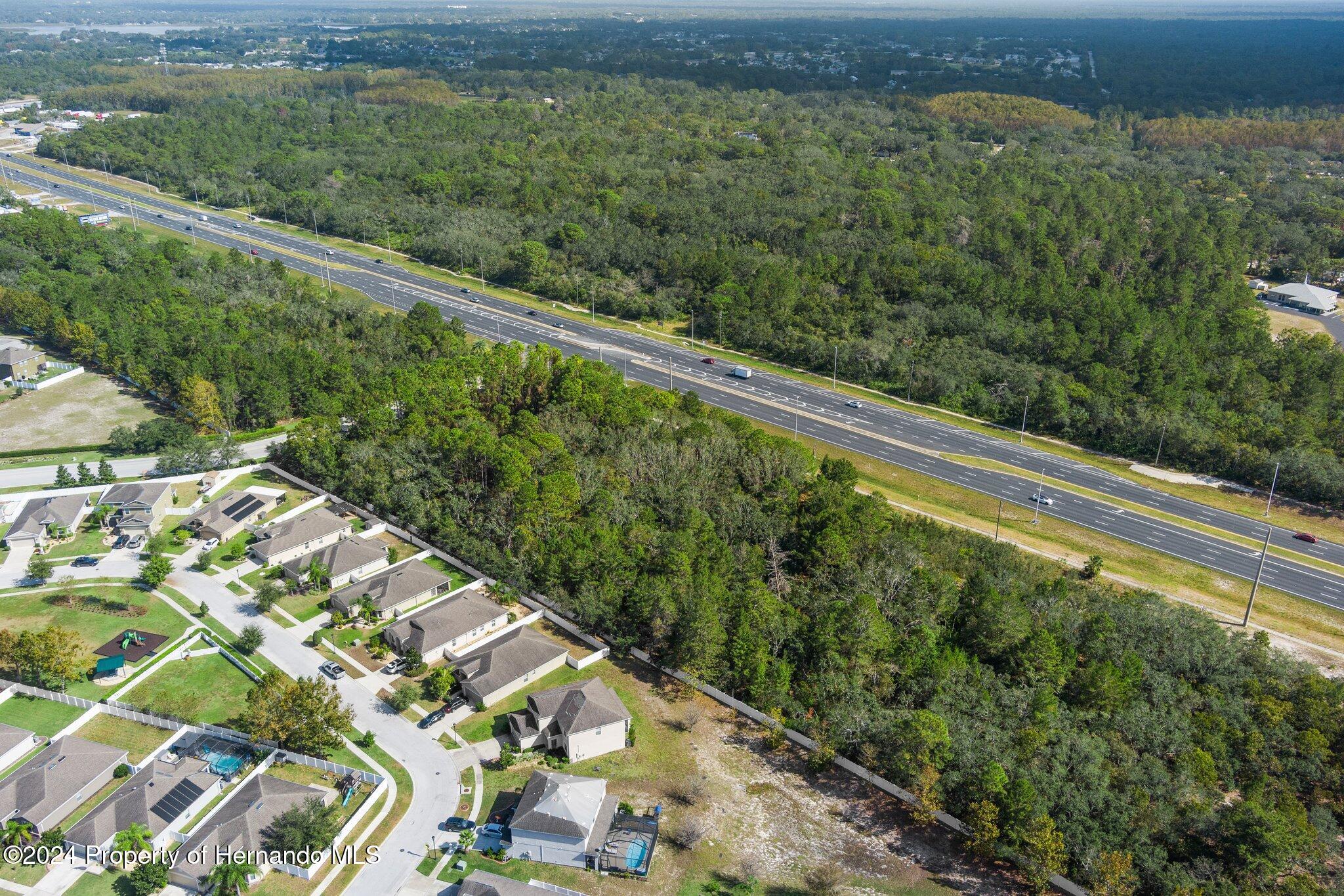 18119 Us-19 Hudson, FL 34667 - Photo 38 of 47 a view of a yard with a wooden fence