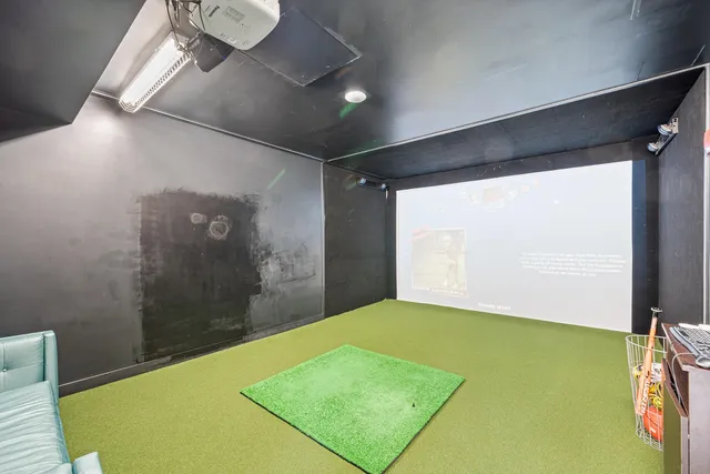 a bathroom with double vanity and a mirror