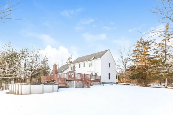 a view of a house with a snow in the yard