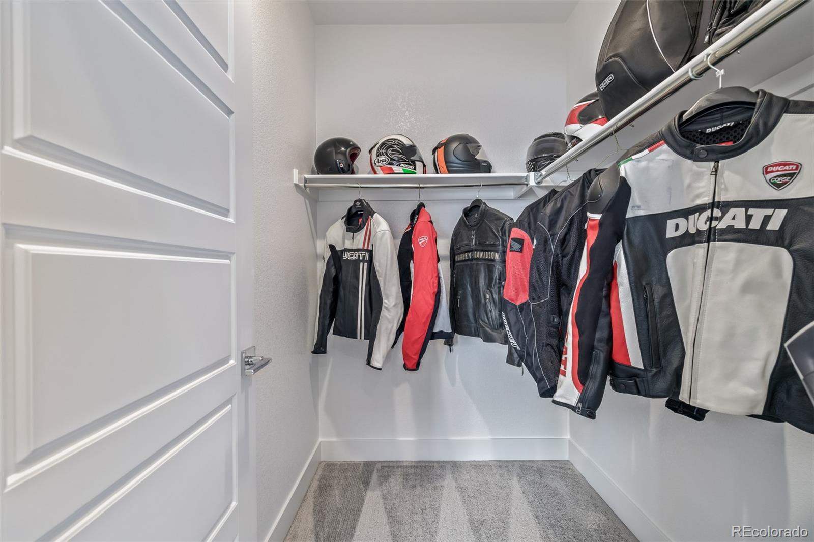 2350 Tremont Place, Unit 13 Denver, CO 80205 - Photo 19 of 41 a view of walk in closet with clothes