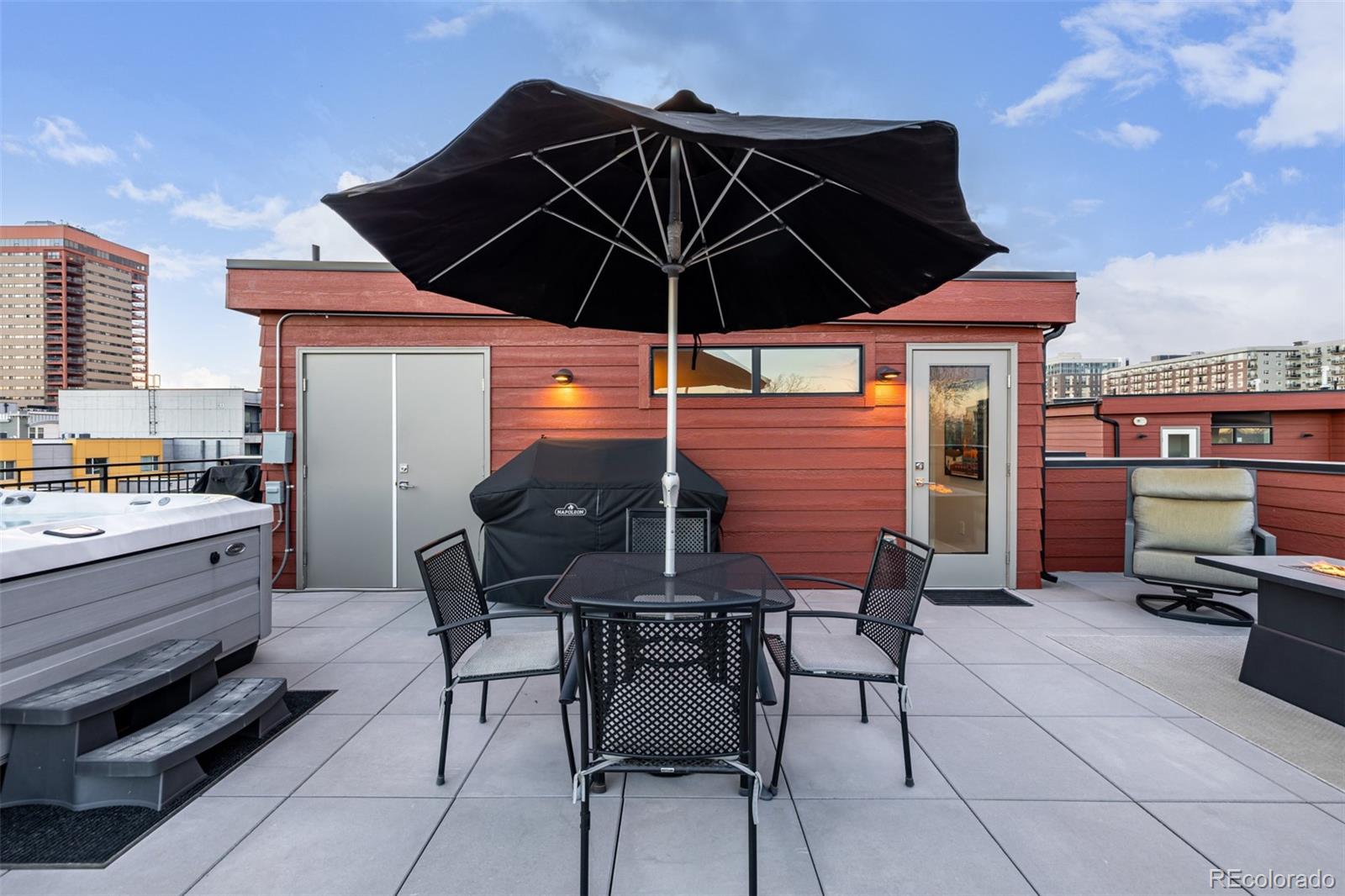 2350 Tremont Place, Unit 13 Denver, CO 80205 - Photo 34 of 41 a patio with a table and chairs