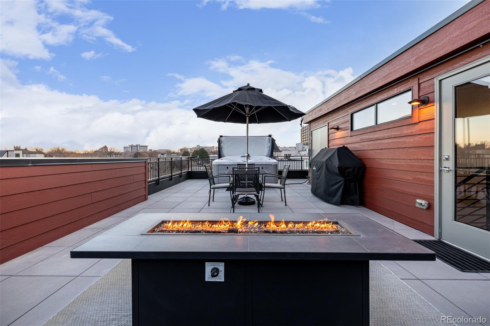 2350 Tremont Place, Unit 13 Denver, CO 80205 - Photo 40 of 41 a view of swimming pool with a table and chairs