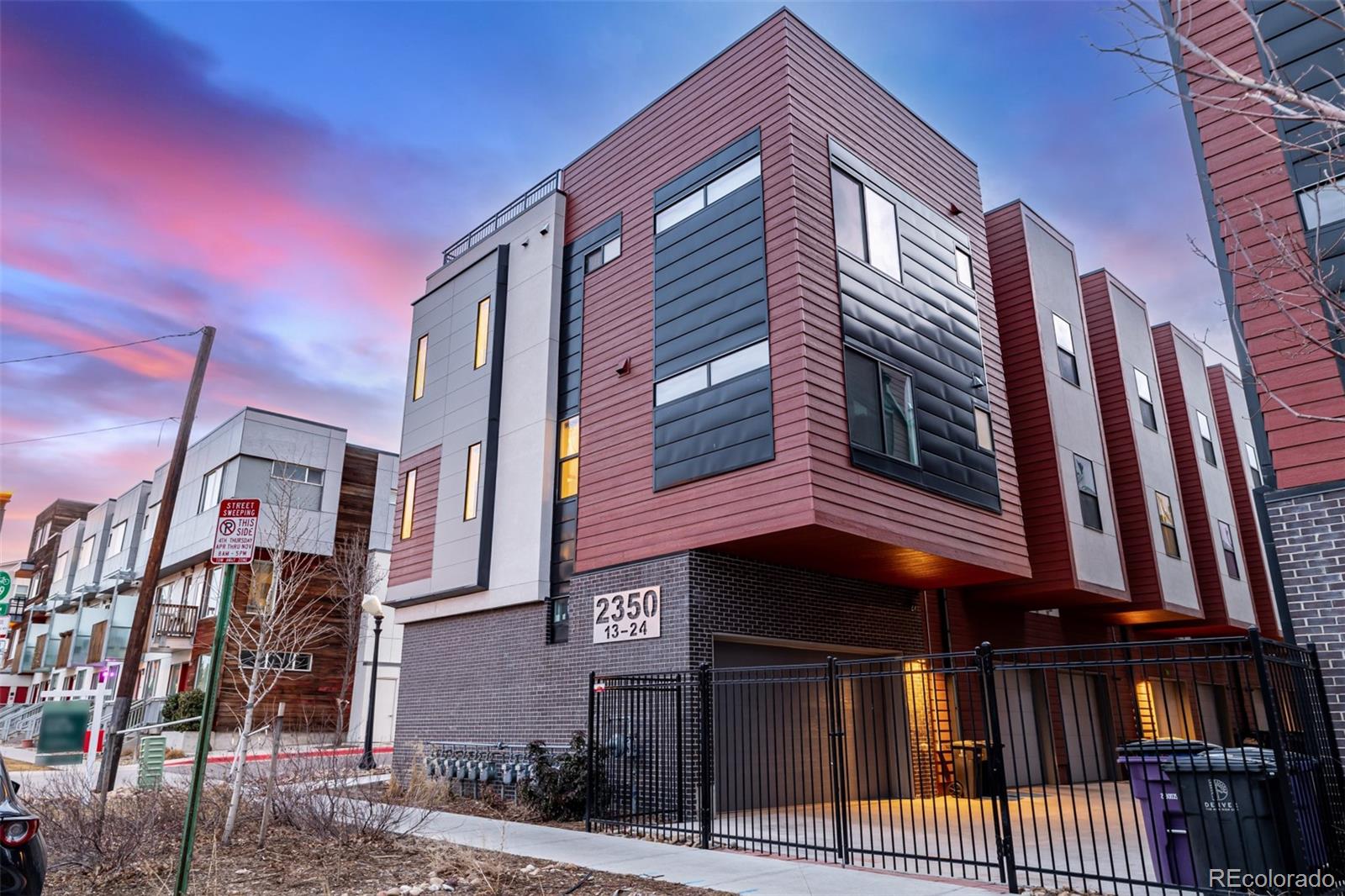 2350 Tremont Place, Unit 13 Denver, CO 80205 - Photo 41 of 41 a view of a house with a garage