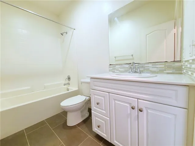 a bathroom with a sink a toilet and a bathtub