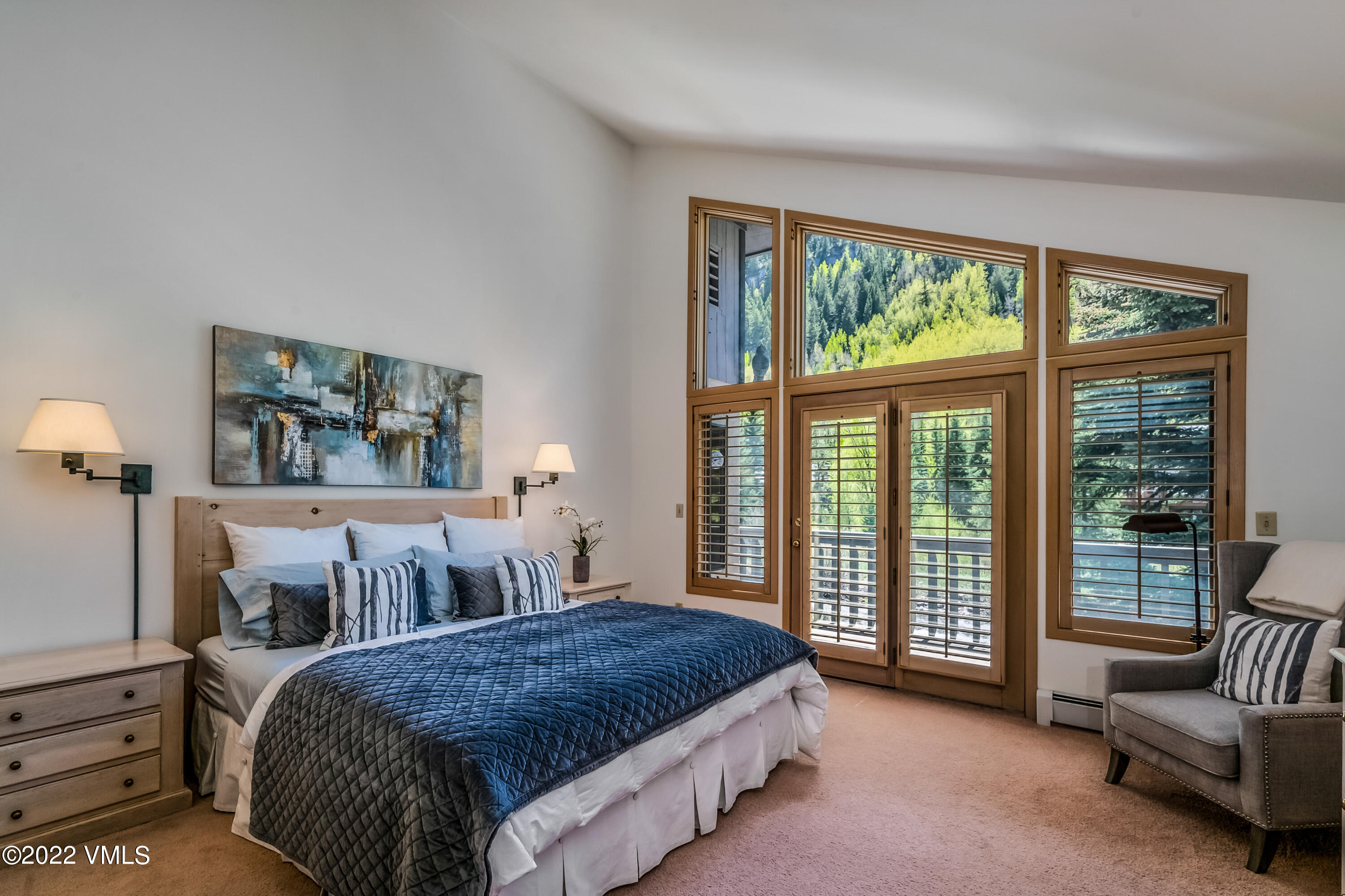 3984 Big Horn Road, Unit A Vail, CO 81657 - Photo 11 of 50 a spacious bedroom with a bed and a large window