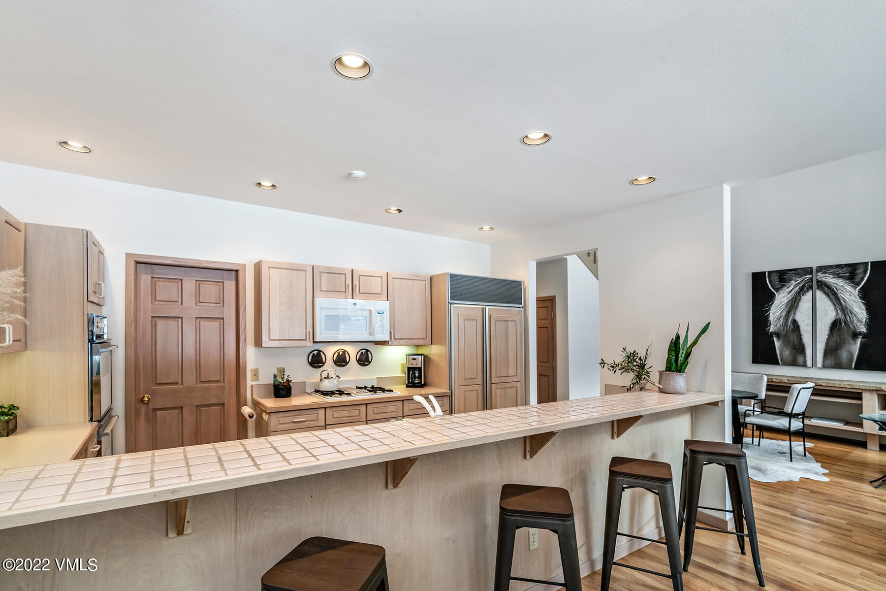 3984 Big Horn Road, Unit A Vail, CO 81657 - Photo 21 of 50 a kitchen with stainless steel appliances granite countertop a sink and a refrigerator