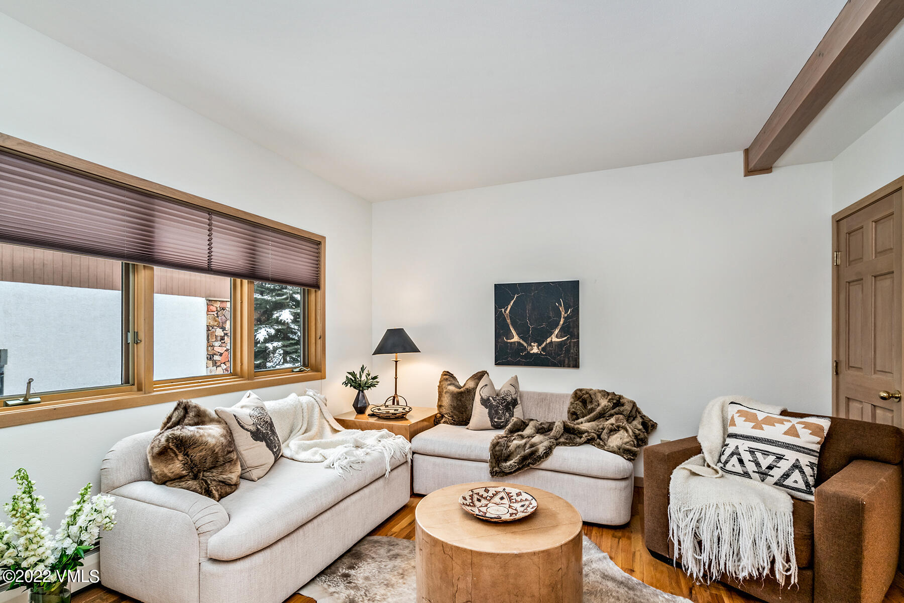 3984 Big Horn Road, Unit A Vail, CO 81657 - Photo 25 of 50 a living room with furniture and a flat screen tv
