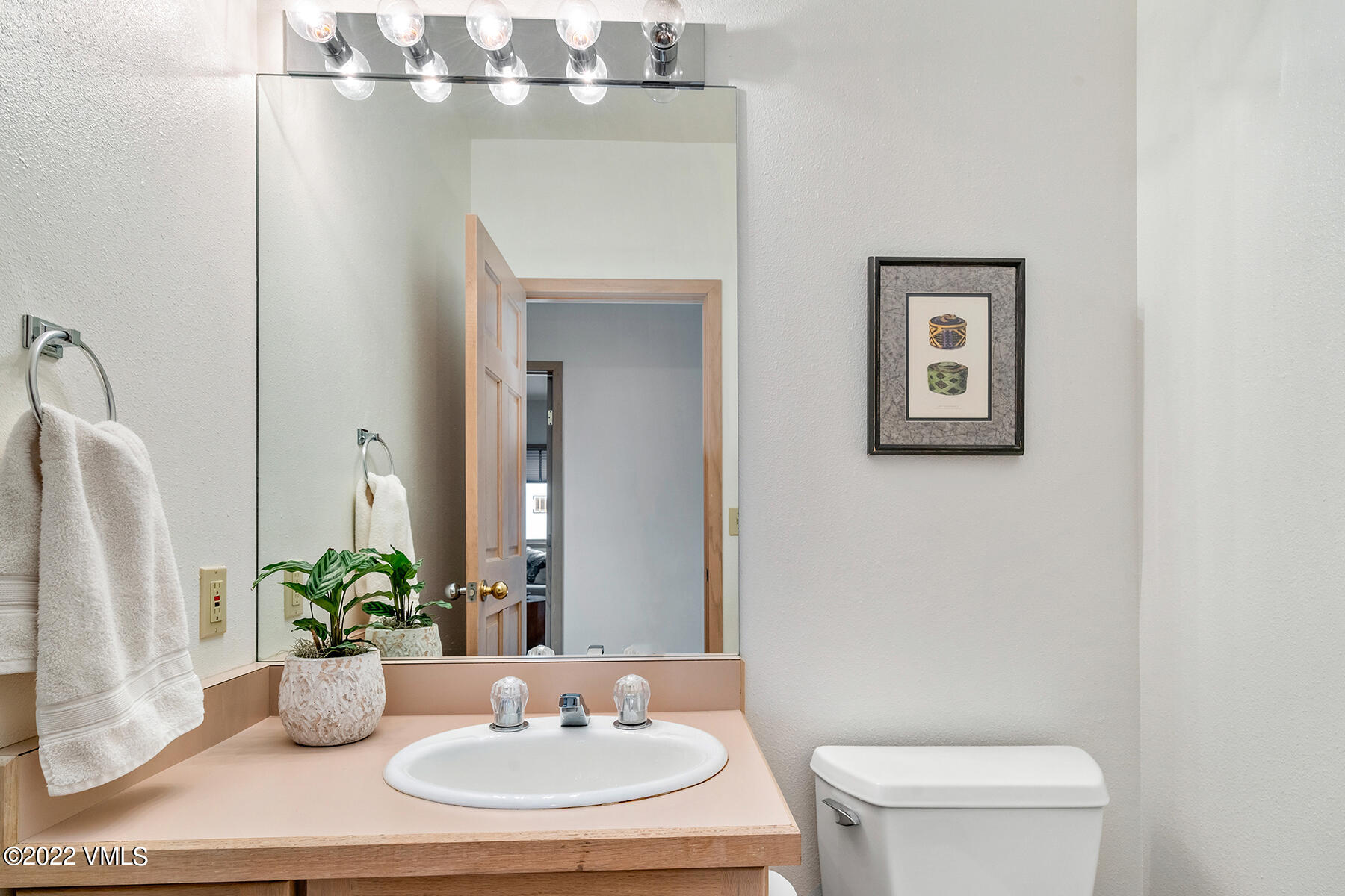 3984 Big Horn Road, Unit A Vail, CO 81657 - Photo 27 of 50 a bathroom with a toilet a sink and a mirror