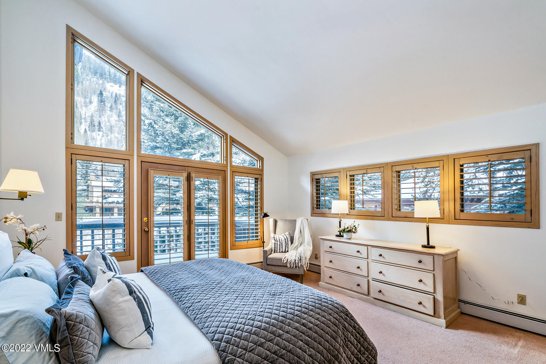 3984 Big Horn Road, Unit A Vail, CO 81657 - Photo 28 of 50 a bedroom with a bed and a large window
