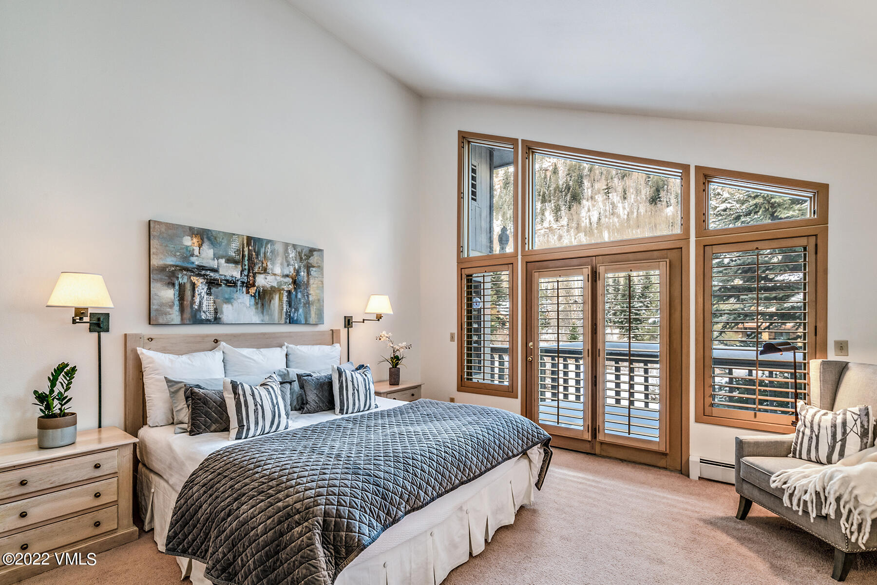 3984 Big Horn Road, Unit A Vail, CO 81657 - Photo 29 of 50 a spacious bedroom with a bed and a large window