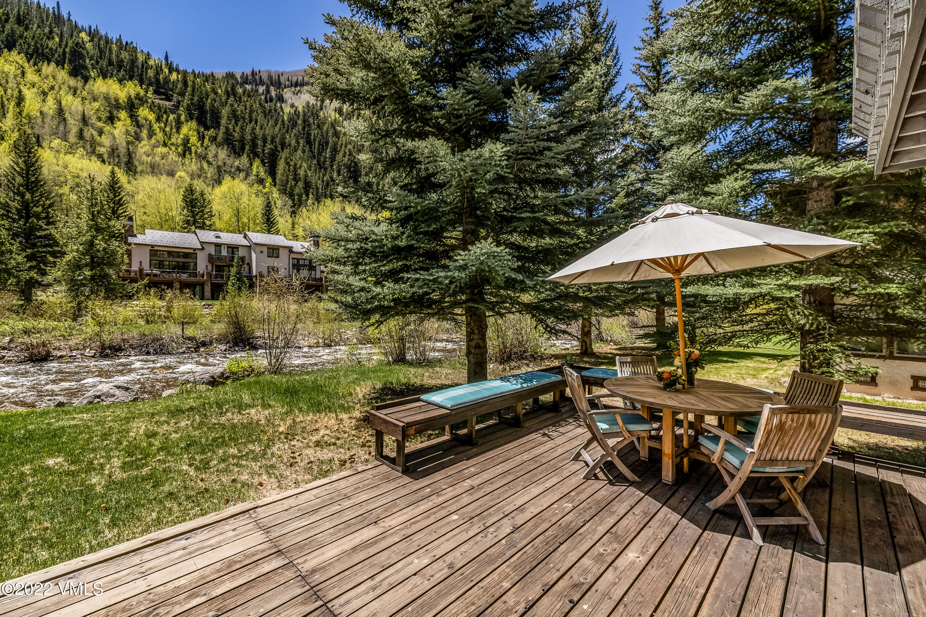 3984 Big Horn Road, Unit A Vail, CO 81657 - Photo 3 of 50 a view of a chairs and table on the wooden deck