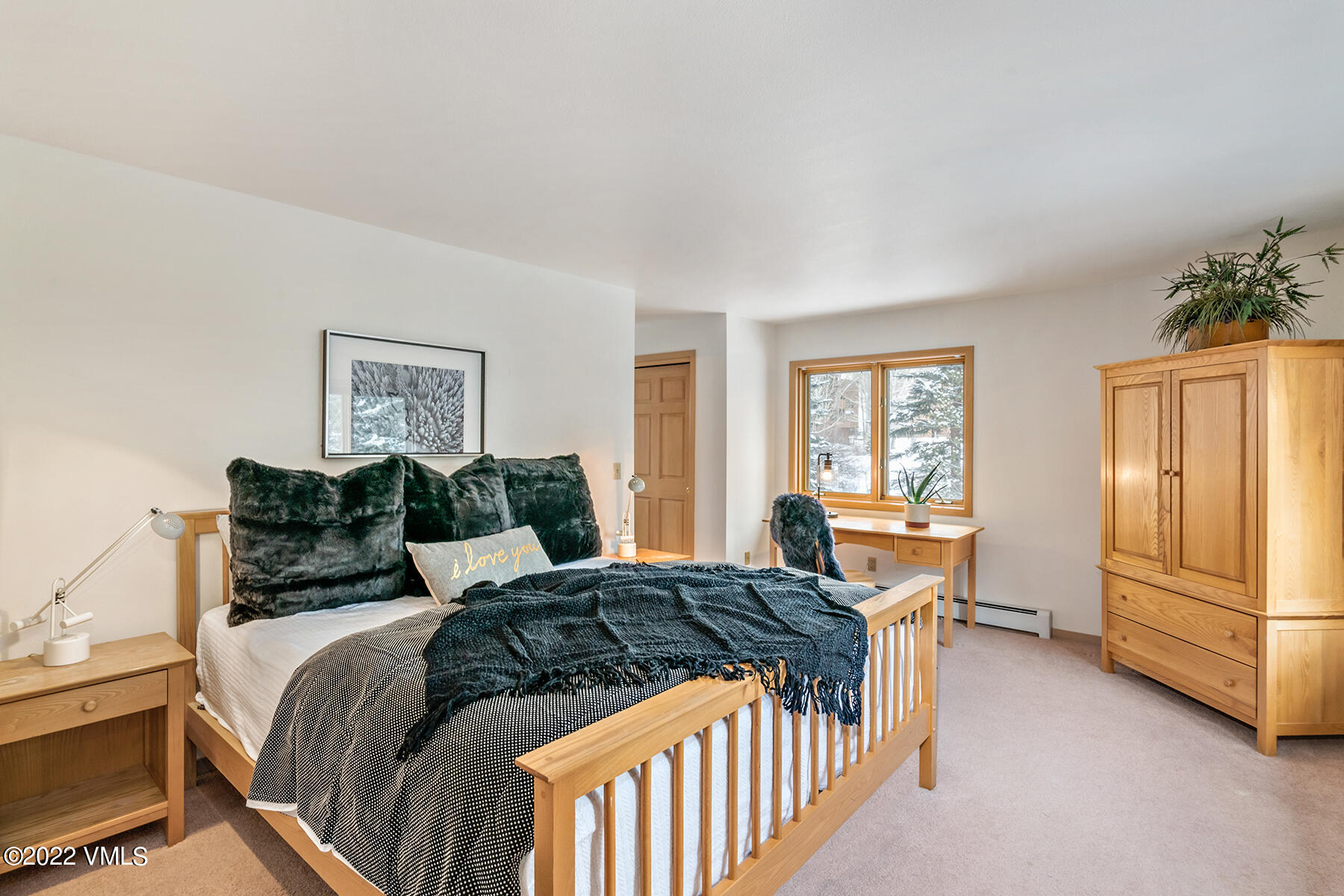 3984 Big Horn Road, Unit A Vail, CO 81657 - Photo 35 of 50 a bedroom with a bed and wooden floor