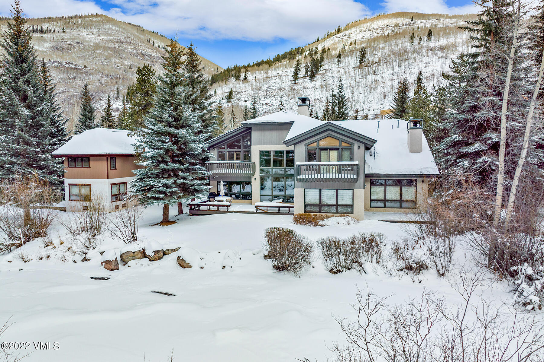 3984 Big Horn Road, Unit A Vail, CO 81657 - Photo 40 of 50 a front view of a house with a yard