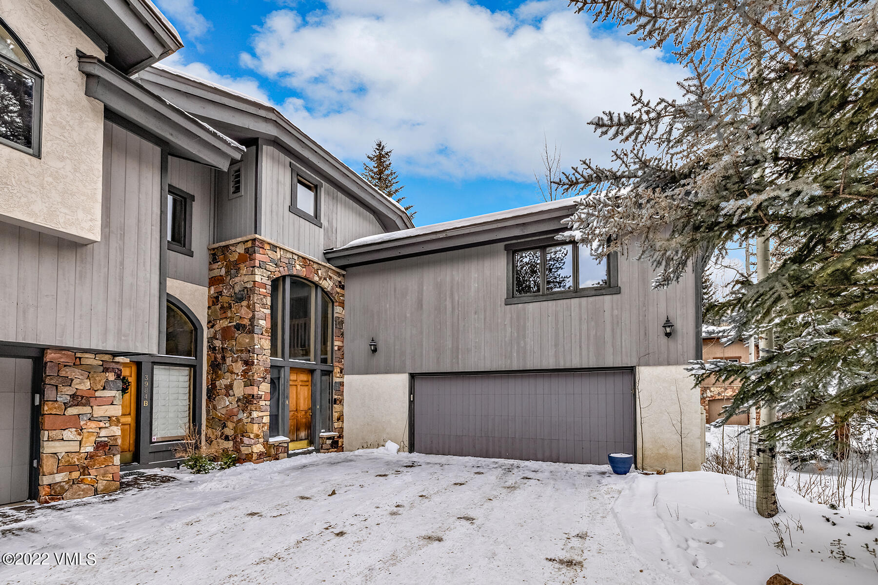 3984 Big Horn Road, Unit A Vail, CO 81657 - Photo 45 of 50 a view of a house with a snow in the background