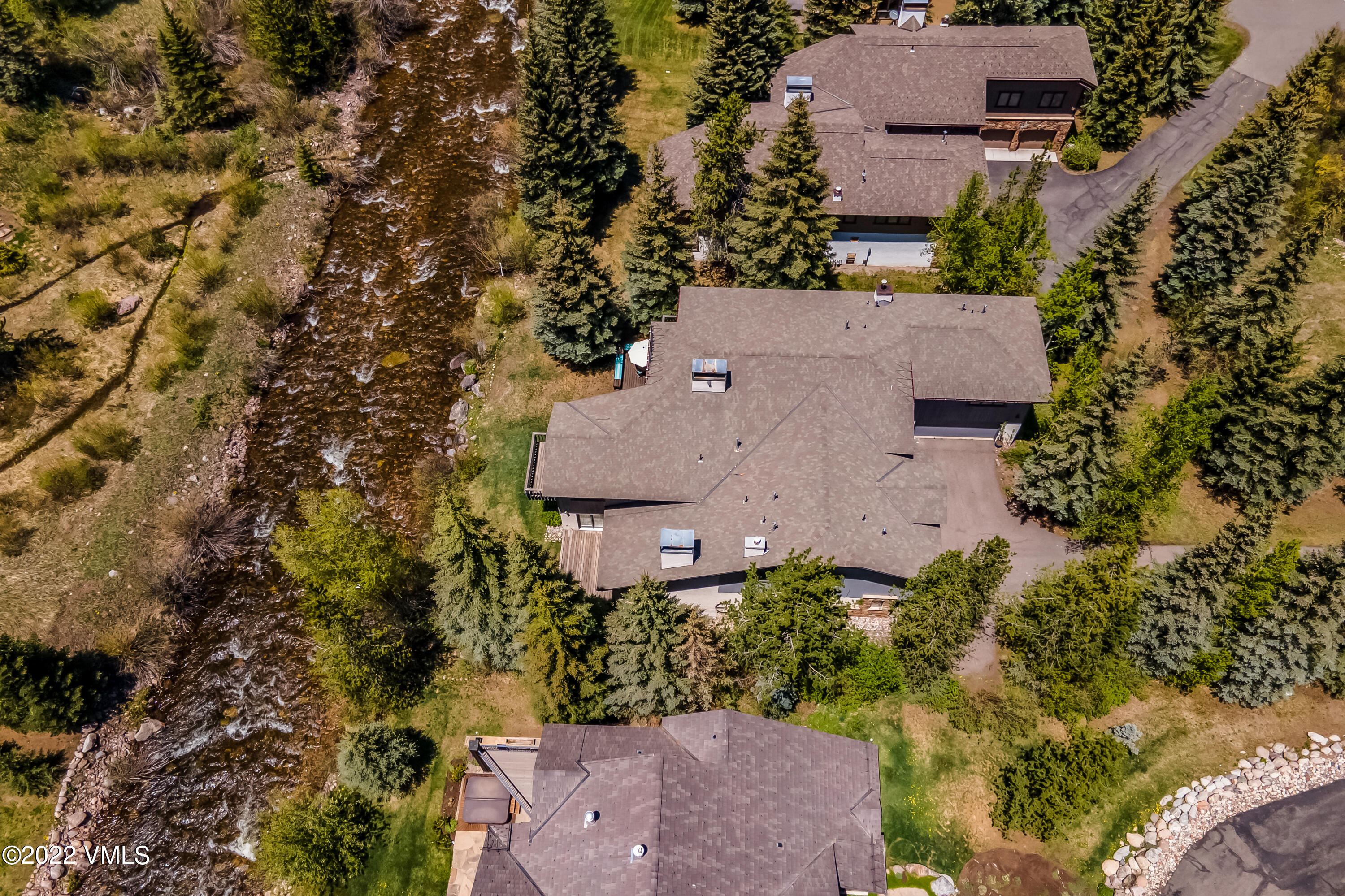 3984 Big Horn Road, Unit A Vail, CO 81657 - Photo 5 of 50 an aerial view of a house with a yard and lake view