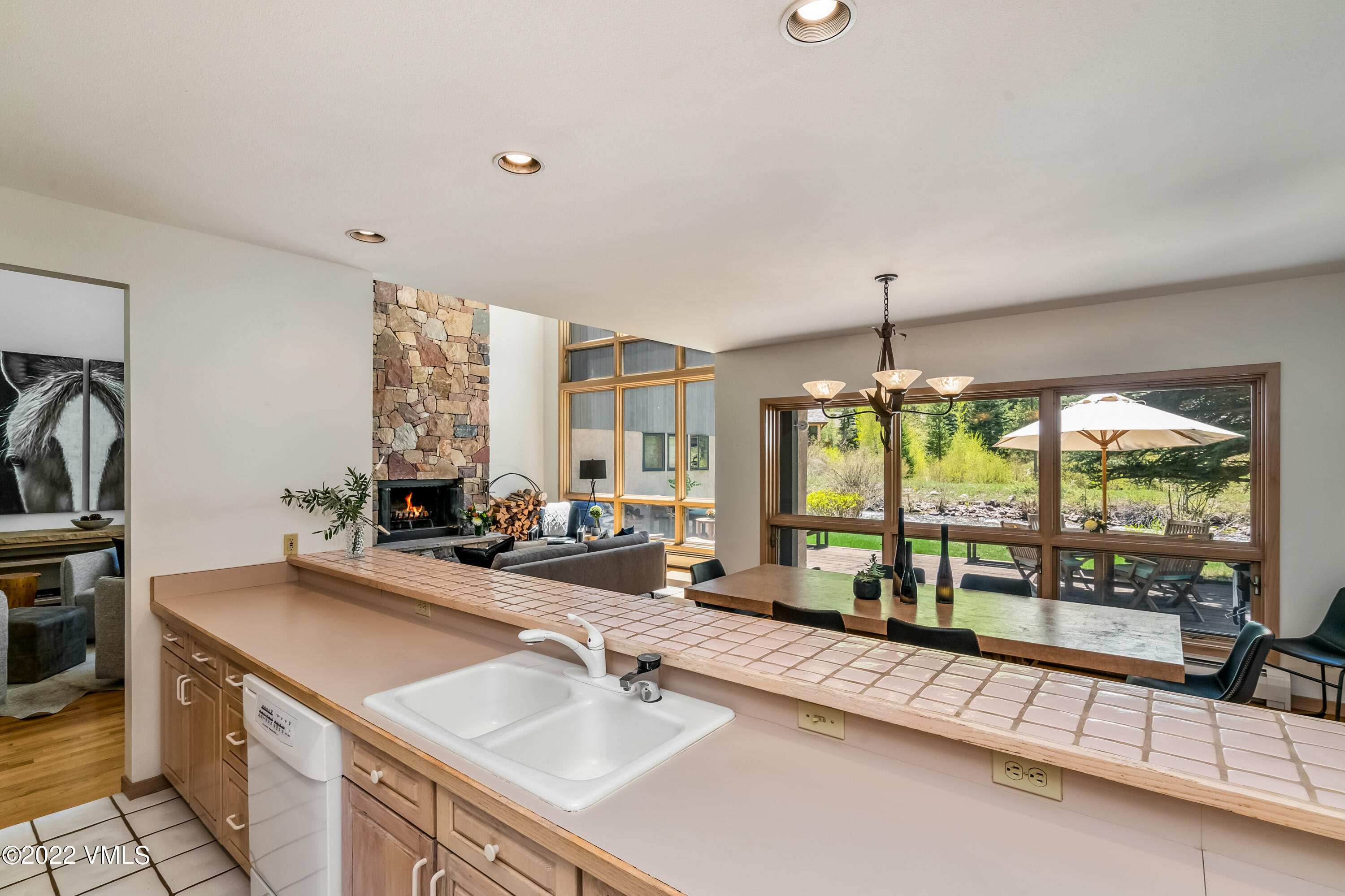 3984 Big Horn Road, Unit A Vail, CO 81657 - Photo 9 of 50 a bathroom with sink a large mirror and a bathtub