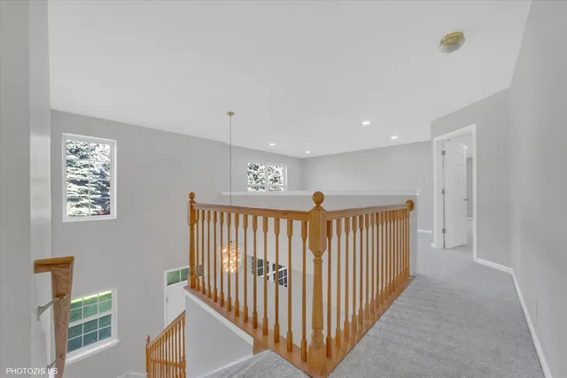 a view of an empty room and a window