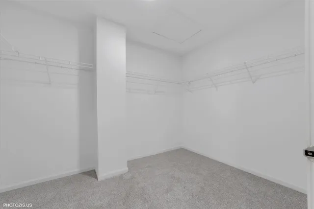 a spacious bathroom with a double vanity sink mirror and bathtub