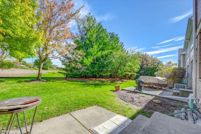 a view of a chair and table in the yard