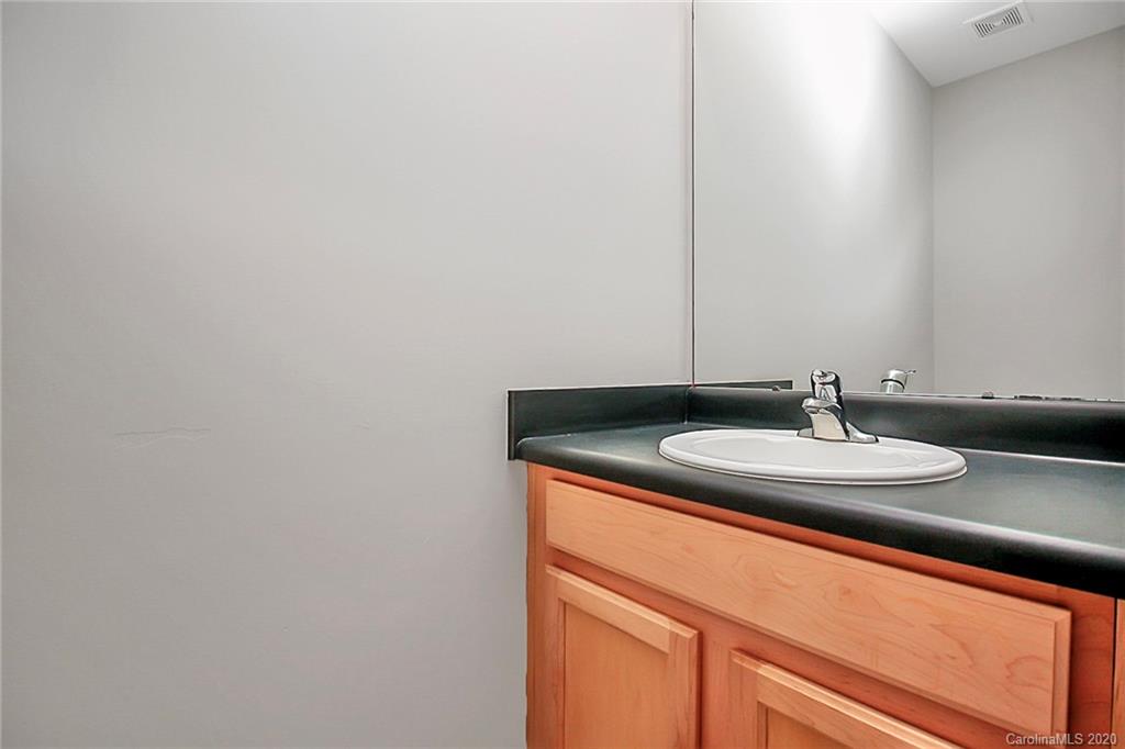 648 Raphael Place Charlotte, NC 28205 - Photo 12 of 48 a bathroom with a sink and a mirror