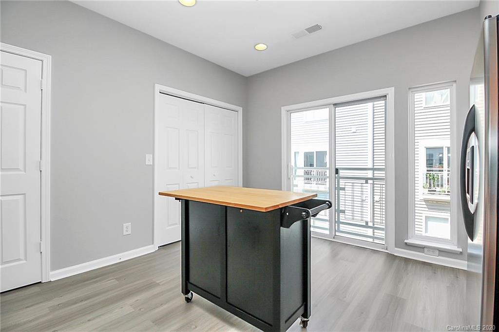 648 Raphael Place Charlotte, NC 28205 - Photo 19 of 48 a room with stainless steel appliances granite countertop a stove and a refrigerator