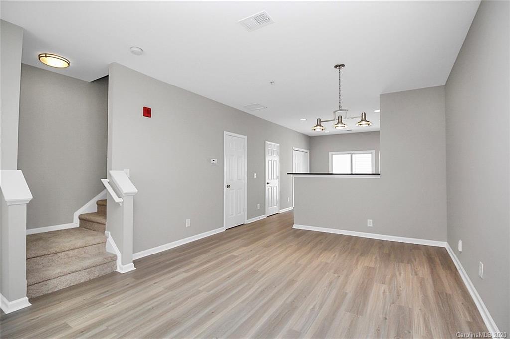 648 Raphael Place Charlotte, NC 28205 - Photo 3 of 48 a view of empty room with wooden floor and window
