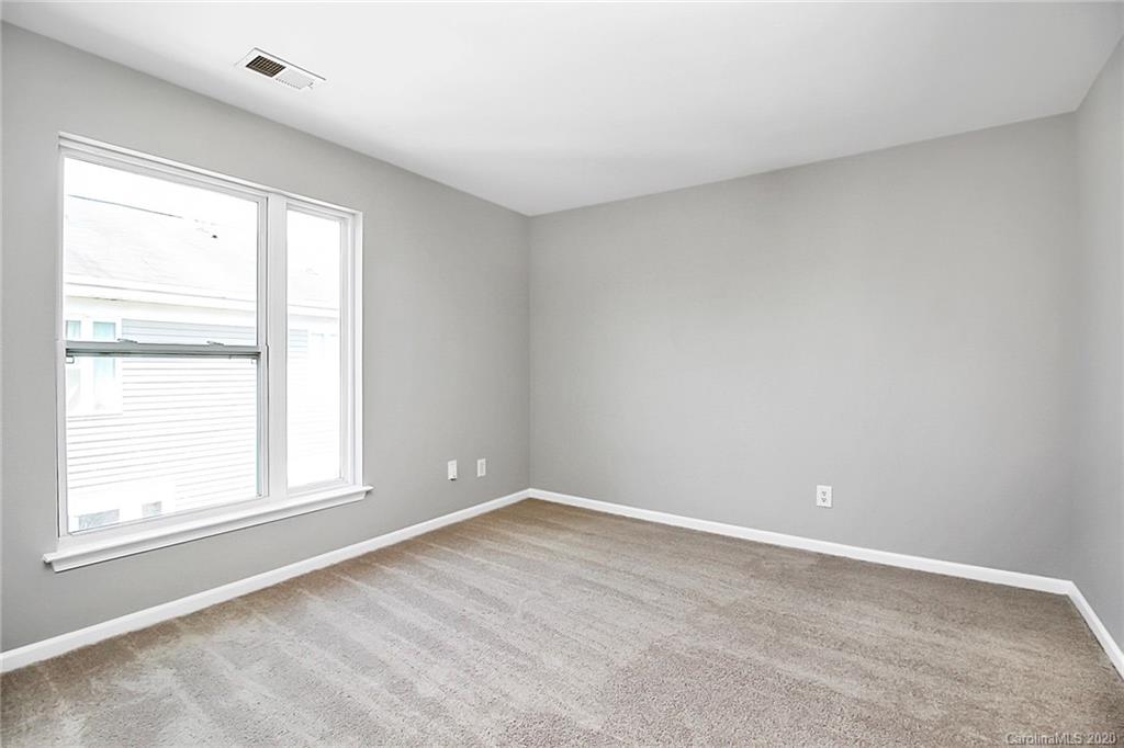 648 Raphael Place Charlotte, NC 28205 - Photo 27 of 48 a view of an empty room with a window