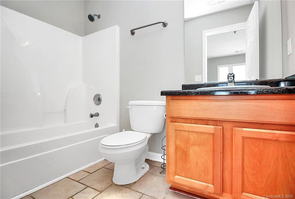 648 Raphael Place Charlotte, NC 28205 - Photo 30 of 48 a bathroom with a sink a toilet and a bathtub