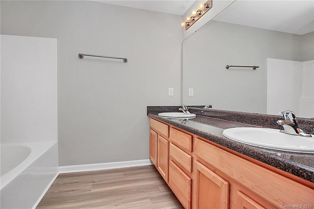 648 Raphael Place Charlotte, NC 28205 - Photo 34 of 48 a bathroom with a sink and a mirror