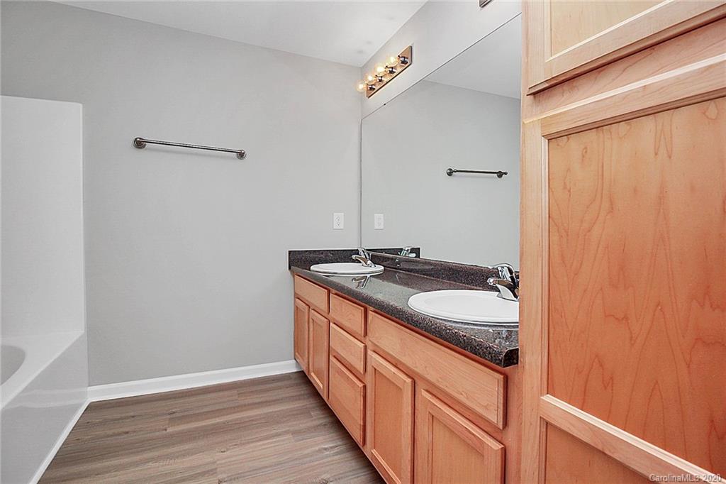 648 Raphael Place Charlotte, NC 28205 - Photo 35 of 48 a bathroom with a sink and a mirror