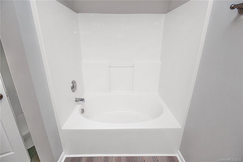 648 Raphael Place Charlotte, NC 28205 - Photo 36 of 48 a close up of a bathtub in a bathroom