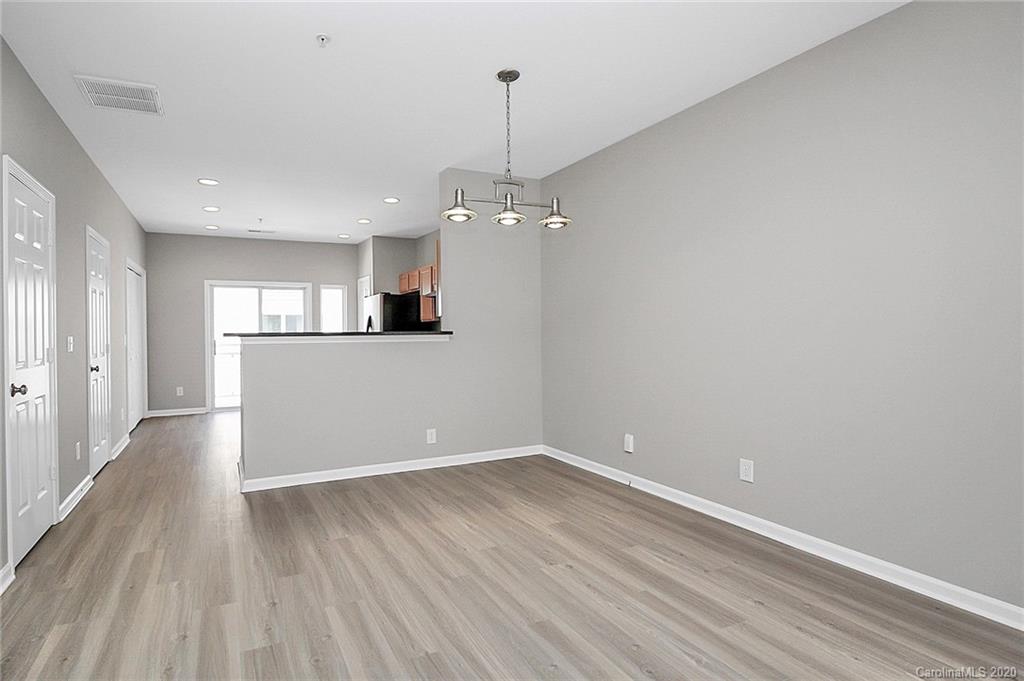 648 Raphael Place Charlotte, NC 28205 - Photo 9 of 48 a view of a room with wooden floor and a window