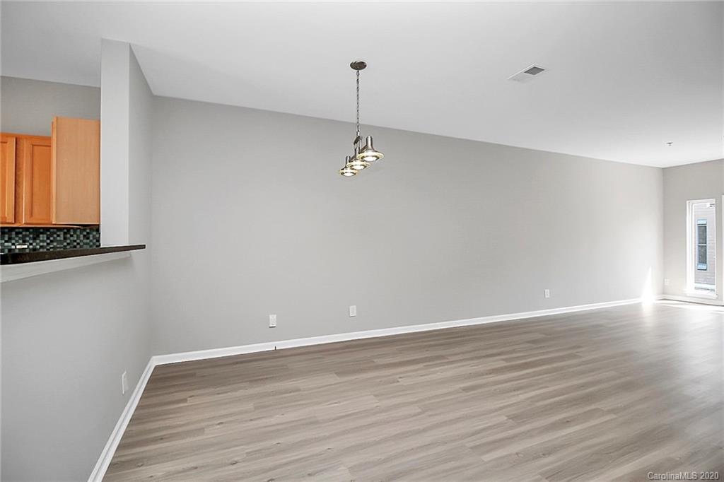 648 Raphael Place Charlotte, NC 28205 - Photo 10 of 48 a view of a room with wooden floor and white walls