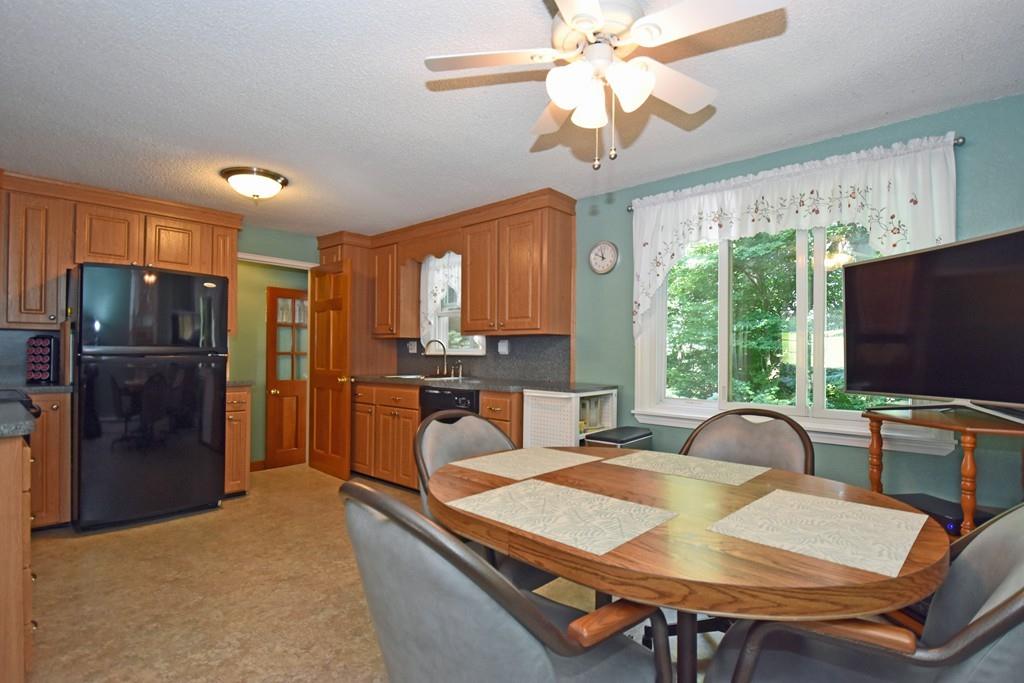 18 Grace Road Woburn, MA 01801 - Photo 6 of 26 a view of a dining room with furniture window and outside view