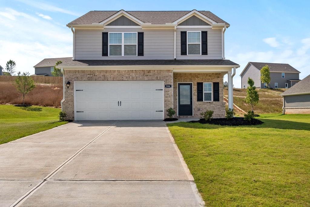 986 Minden Terrace Fairburn, GA 30213 - Photo 1 of 1 a front view of a house with garden