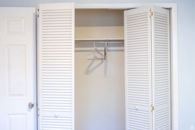 1269 North 400 East, Unit 3 Logan, UT 84341 - Photo 18 of 23 Louvered bifold closet doors with a metal hanging rod