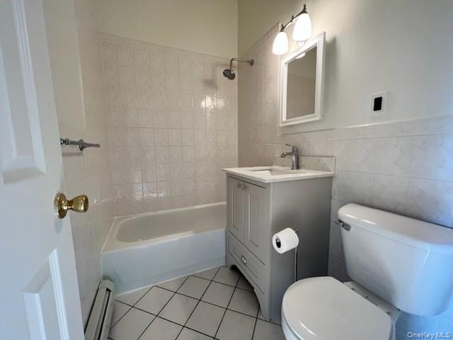 1307 Balcom Avenue Bronx, NY 10461 - Photo 11 of 26 a bathroom with a sink mirror vanity and toilet