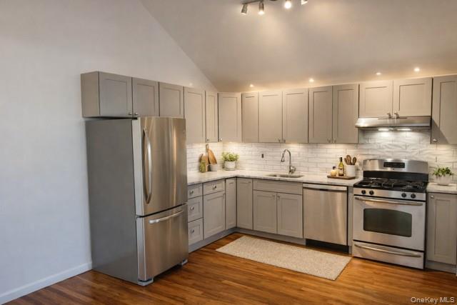 1307 Balcom Avenue Bronx, NY 10461 - Photo 2 of 26 a kitchen with stainless steel appliances granite countertop a stove a refrigerator and a microwave