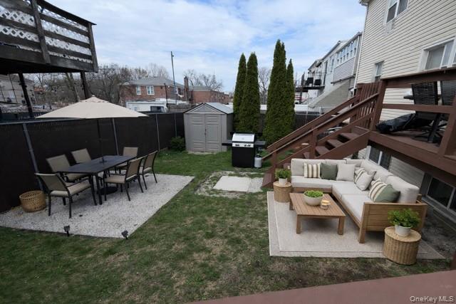 1307 Balcom Avenue Bronx, NY 10461 - Photo 25 of 26 a view of a patio with table and chairs a barbeque