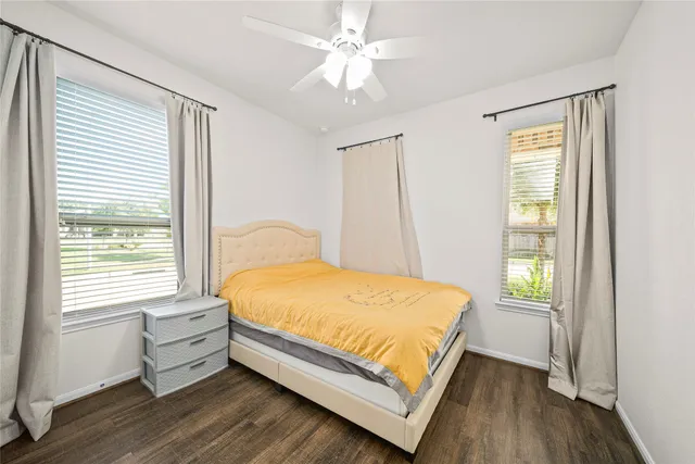 a bed room with a bed and a window