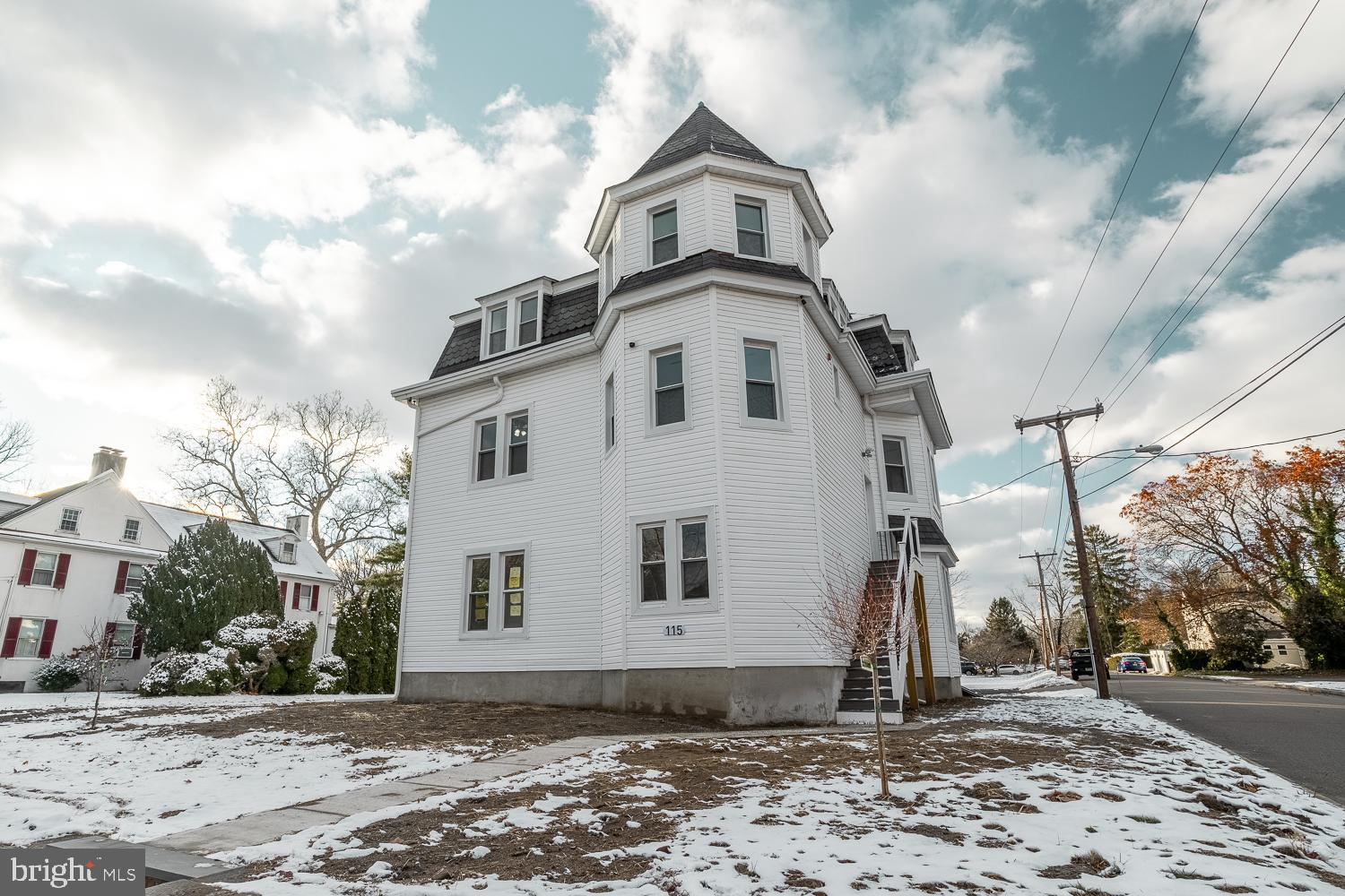 115 Hanover Street, Unit 4 Pemberton, NJ 08068 - Photo 12 of 14 a front view of a house with a yard
