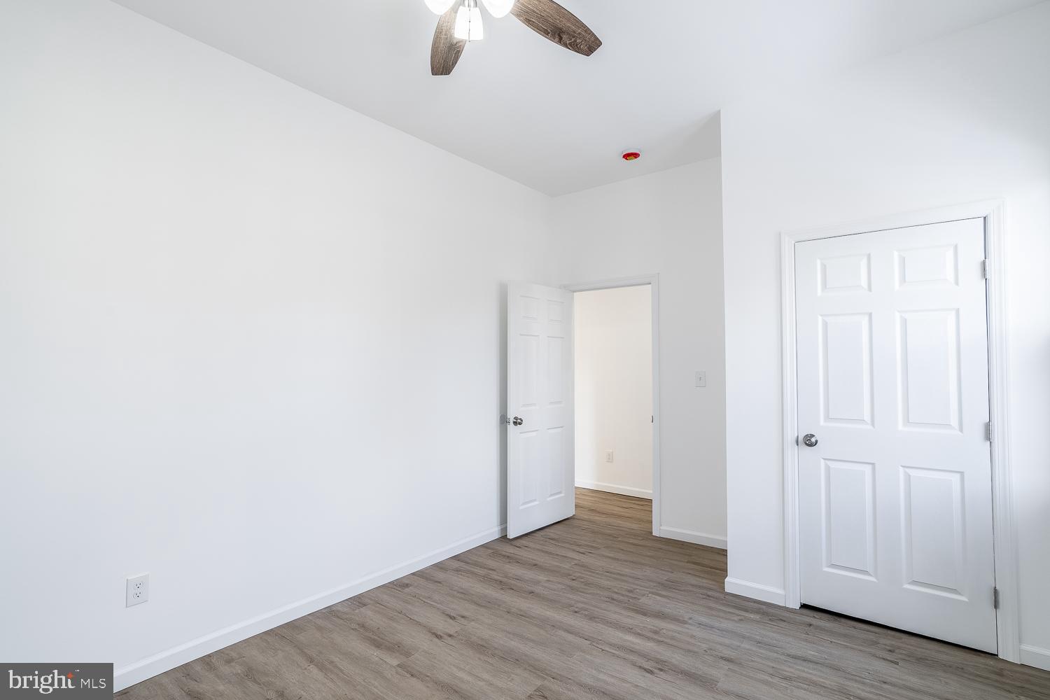 115 Hanover Street, Unit 4 Pemberton, NJ 08068 - Photo 9 of 14 a view of an empty room with wooden floor