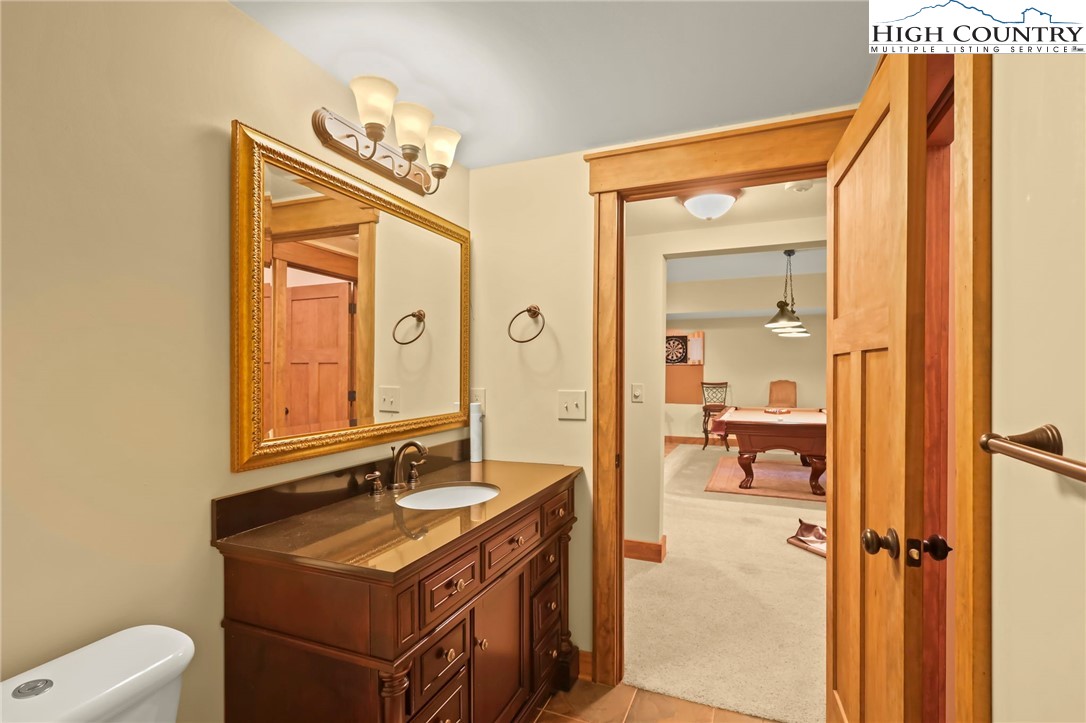138 South Camp Road, Unit 103 Boone, NC 28607 - Photo 40 of 50 a bathroom with a sink mirror and a bathtub
