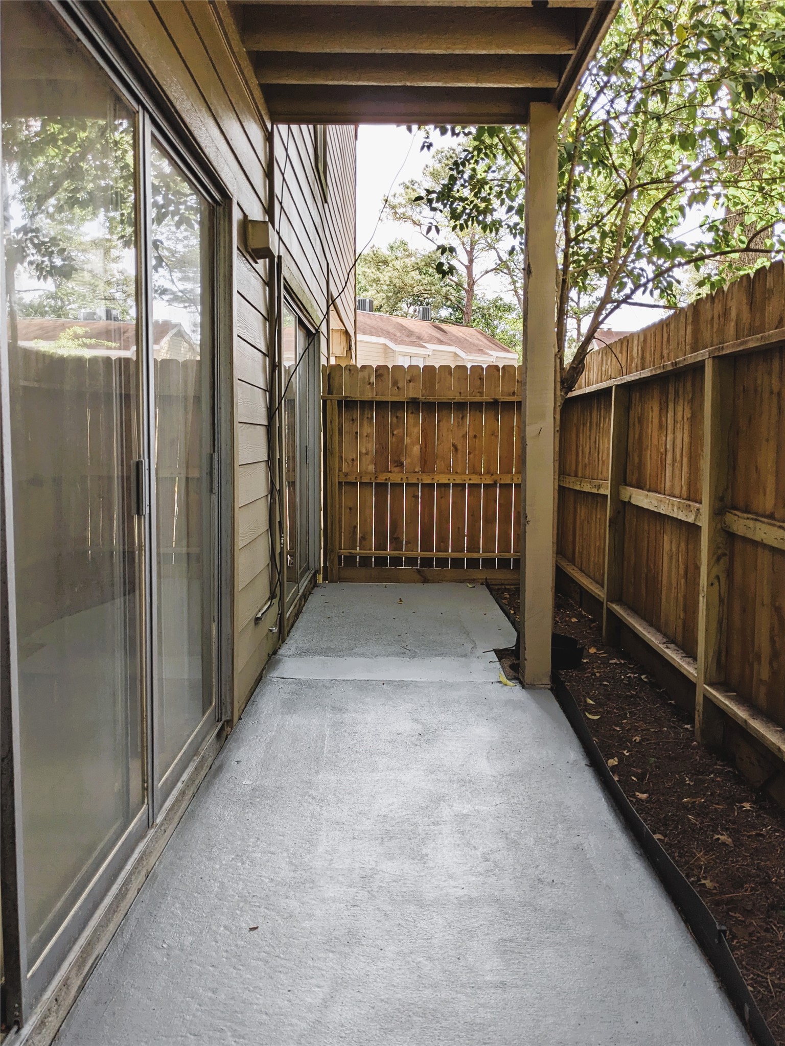 2100 Tanglewilde Street, Unit 421 Houston, TX 77063 - Photo 12 of 21 a view of a porch with wooden floor and outdoor space