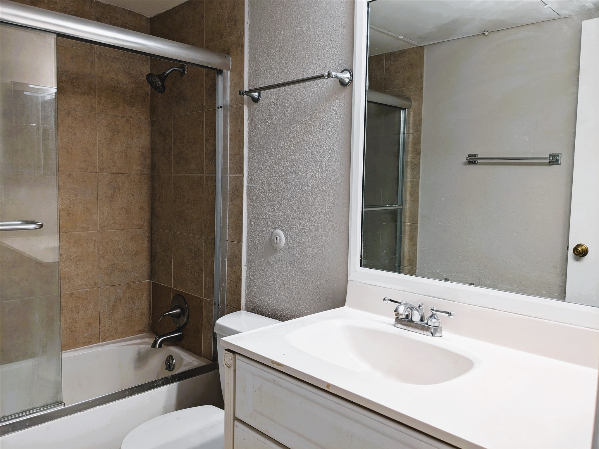 2100 Tanglewilde Street, Unit 421 Houston, TX 77063 - Photo 16 of 21 a bathroom with a granite countertop sink toilet and shower