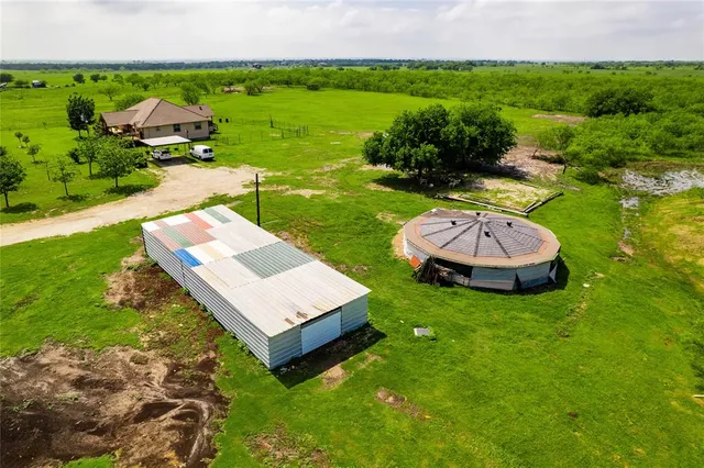 a view of a table and chairs in the garden